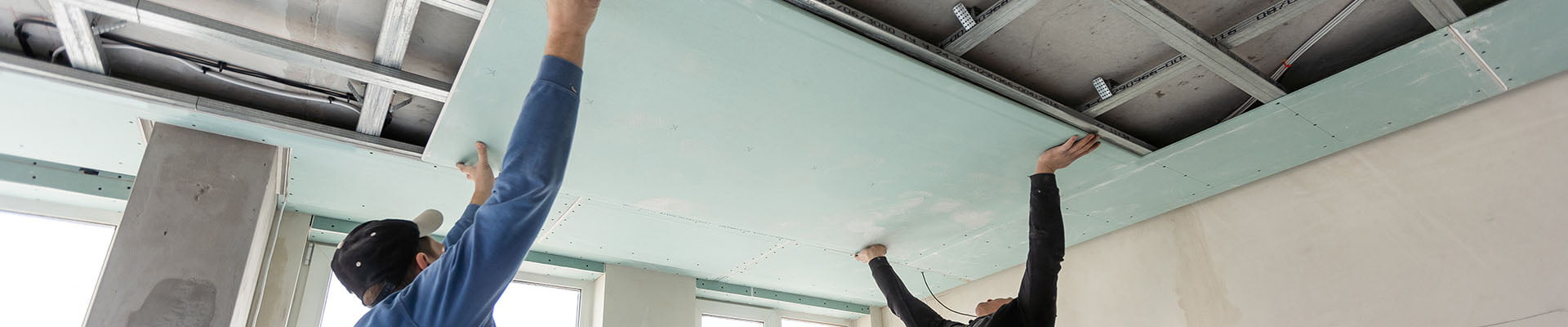 installing plasterboard in a suspended ceiling system